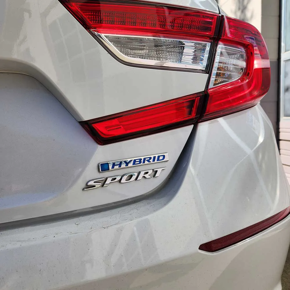 Hybrid sport car rear emblem close-up